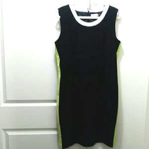 Beautiful sleeveless black dress with neon green stripes on the sides